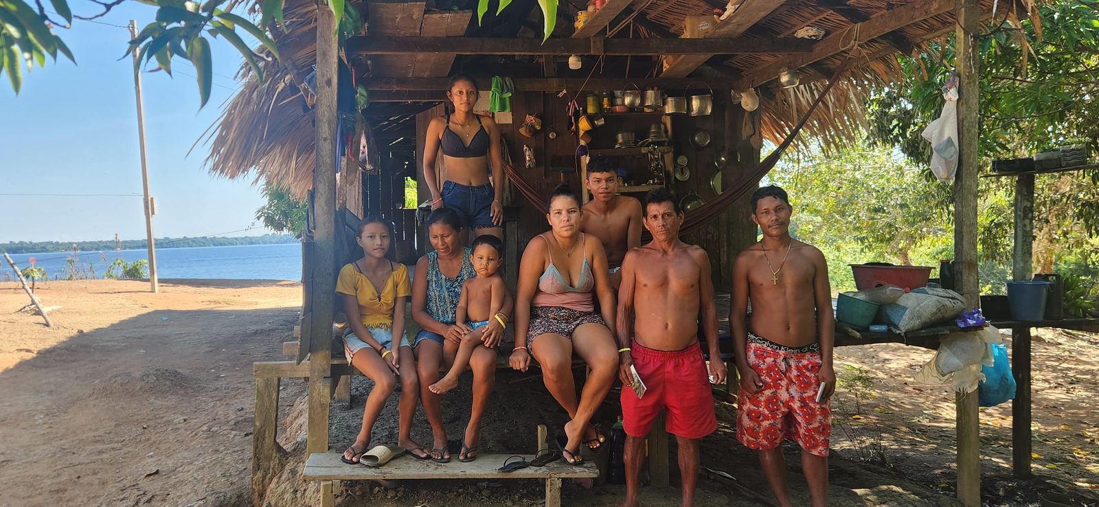 Families at a riverside village in Brazil, photographed on a Dominion trip